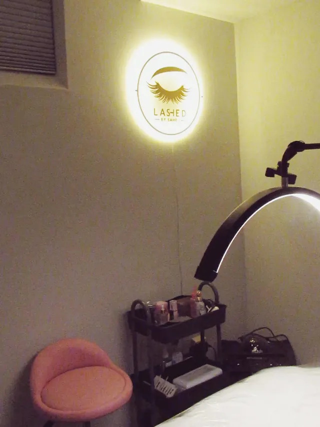 Sahej's home lash studio, with her lit Lashed sign above the lash lamp
